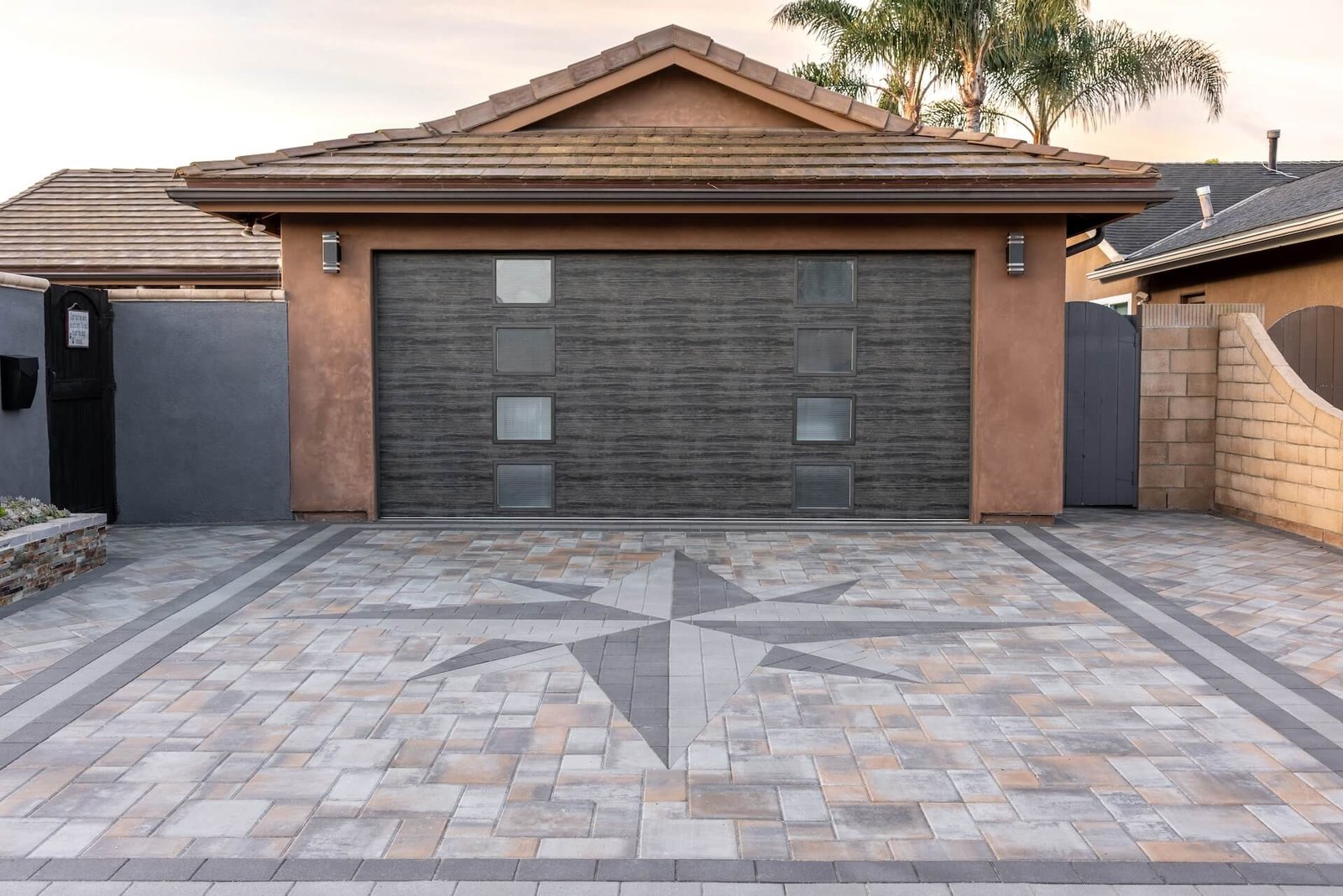 Custom paver driveway with compass design